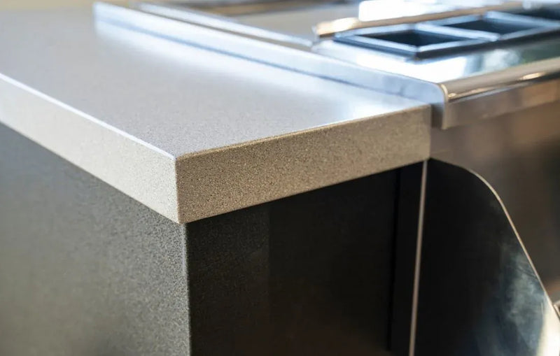 Stainless steel countertop with a kitchen appliance